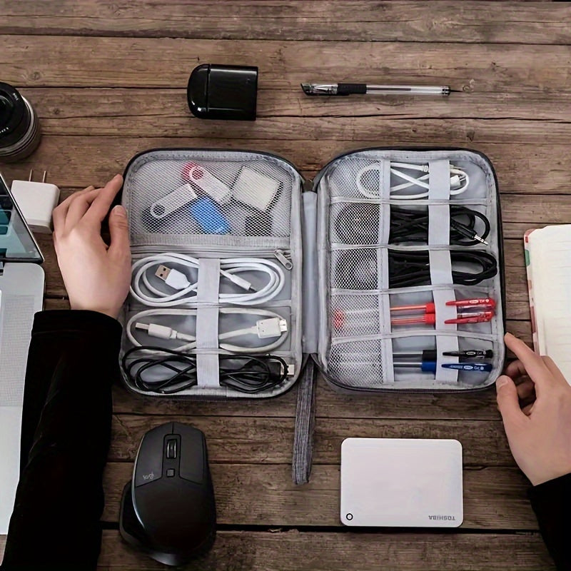 Waterproof digital storage box for travel, organizes various electronic devices and accessories.