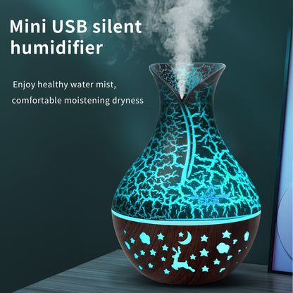 New 150ml vase-shaped air humidifier with hollow wood grain design, LED light, and small night light. USB-powered and automatic shut-off. Ideal for office, home, or bedroom.