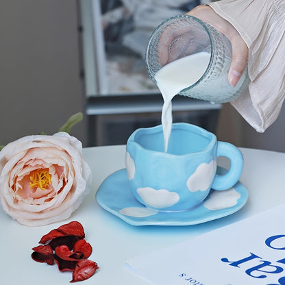 Handcrafted ceramic coffee mug and saucer set with whimsical patterns. Reusable and recyclable, perfect for tea or latte. Hand wash only.