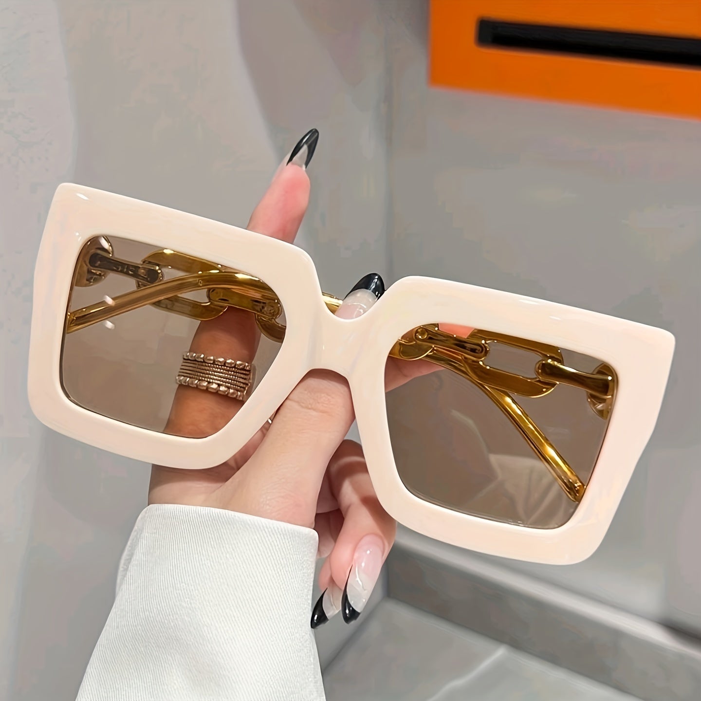 Women's oversized square glasses with a retro style, lightweight frame, unisex design, and pop culture inspiration.