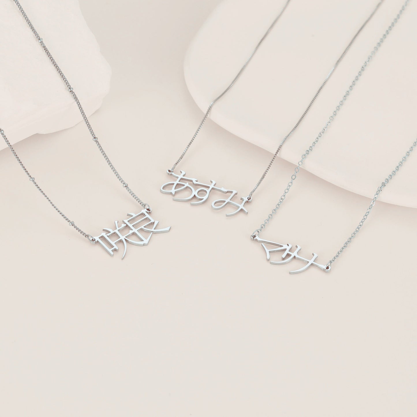 A unique Japanese Kanji name necklace made of stainless steel, featuring custom Katakana and Hiragana pendant. The perfect gift for your mom, sister, or best friend.