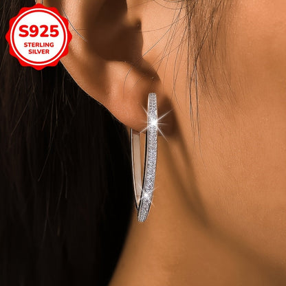 These stunning women's fashion earrings boast a high-end, sophisticated design with V-shaped inlaid synthetic zirconia, weighing 5.5 grams in a silvery hue. Perfect for everyday wear, vacations, parties, banquets, or as a luxurious gift.