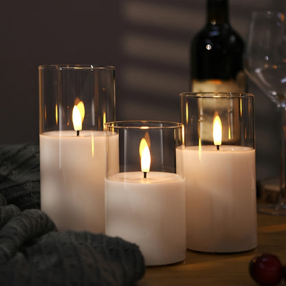 Remote controlled LED candle set with battery operated candles in three different sizes (10.16cm, 12.7cm, 15.24cm) and timer function. Ideal for home decor, parties, and festive occasions.