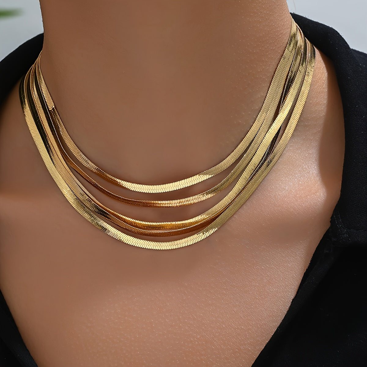 Stylish and sophisticated, this multi-layered flat snake chain necklace is perfect for women. It is made from iron material with luxurious plating, making it a versatile choker that can be worn daily and in all seasons.