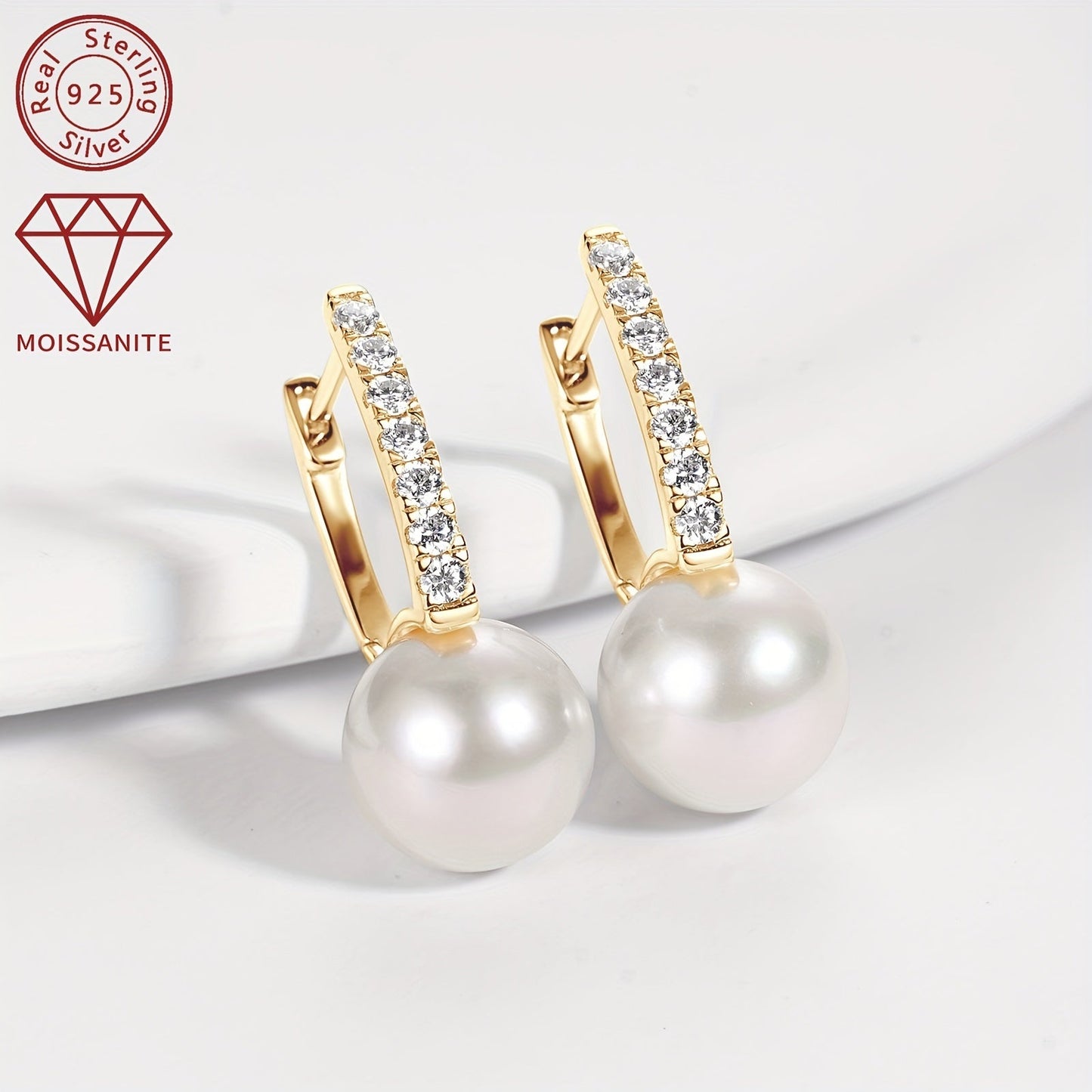 A pair of 925 Silver Women's Fashion Pearl Earrings featuring a round 9.5-10mm Natural Freshwater White Pearl and 14pcs of Moissanite stones measuring 1.8mm each, totaling 0.35ct. The earrings weigh 2.11g in total and are a stunning combination of pearls