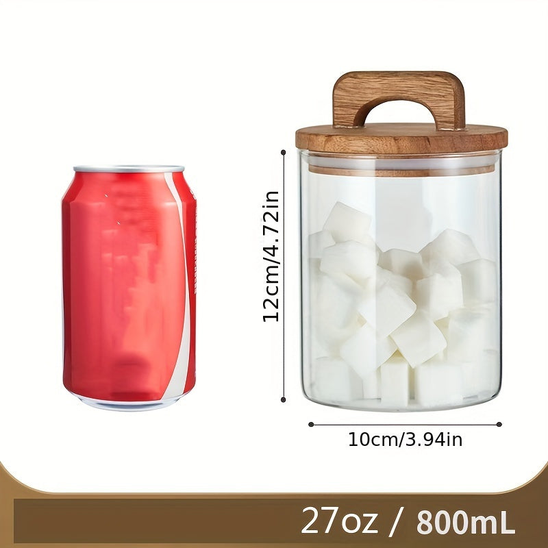 Glass storage jar with a wooden lid and a capacity of 27oz/800mL. This multi-purpose jar is freezer safe and should be hand washed only. Perfect for storing coffee, tea, or food.