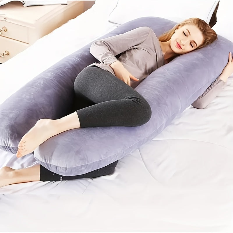 Maternity pillow with U-shaped design for full body support. Soft plush fabric with cover included. Available in gray, pink, blue, and black.