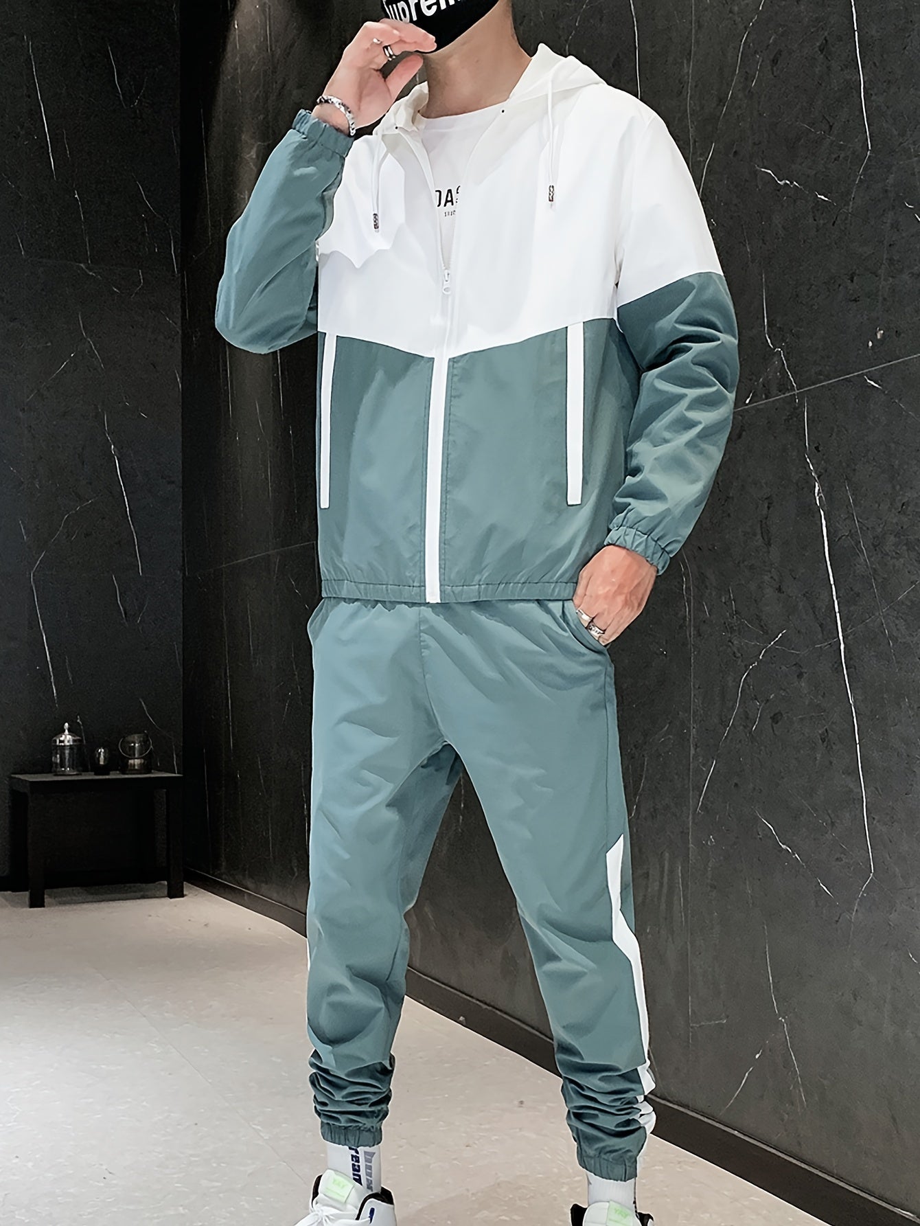 Men's casual sporty green and white zip-up hooded jacket and pants set made of durable woven polyester. Machine washable with pockets, perfect for running, golf, hiking in the spring and