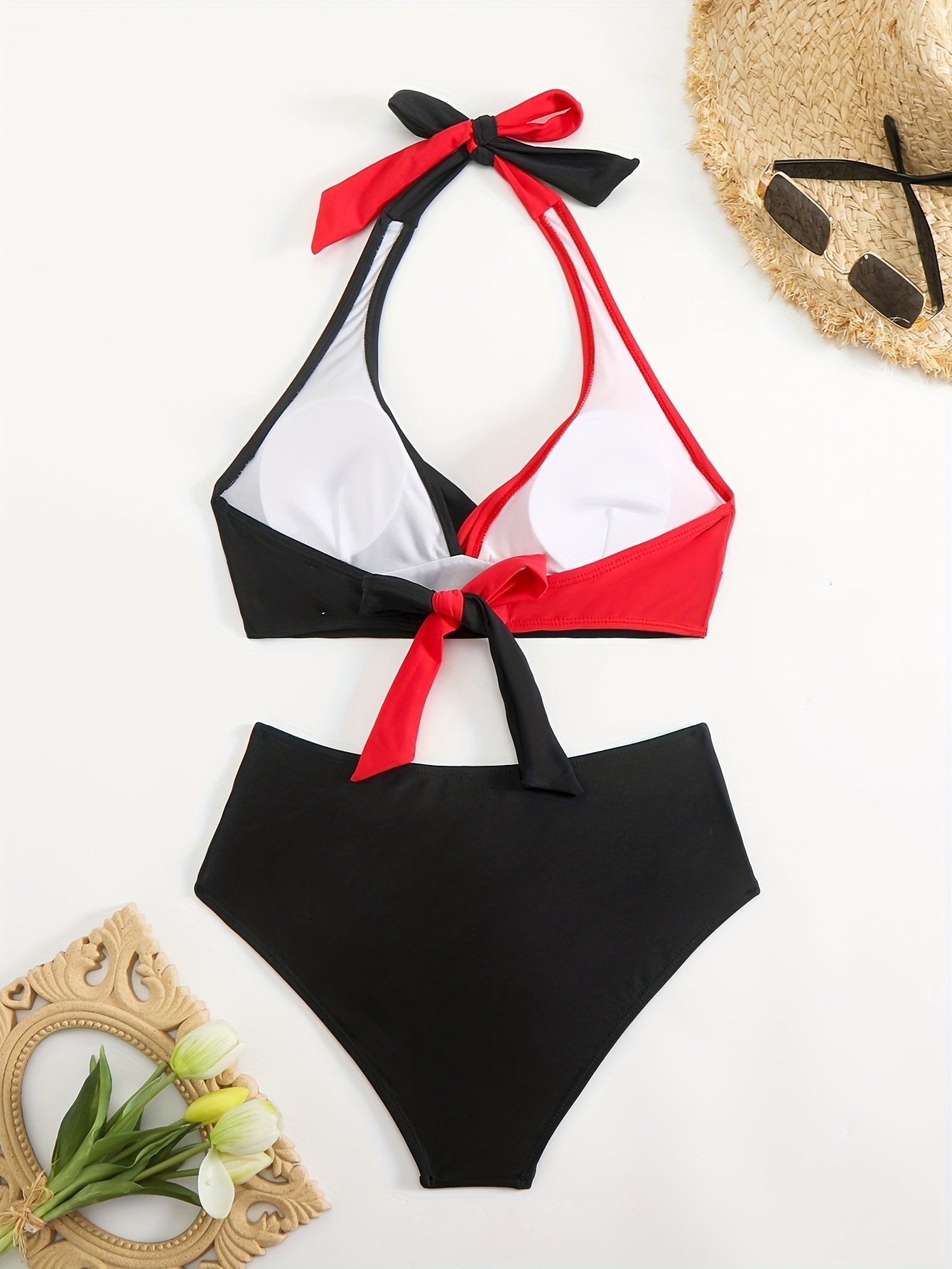 Women's two-piece bikini swimsuit with solid color and sexy patchwork design, featuring a multi-color pattern and neck strap.