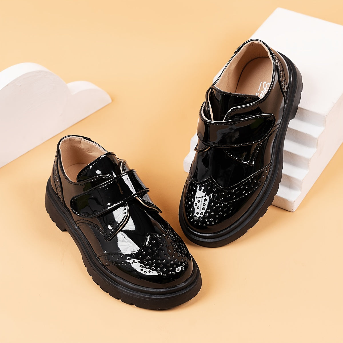 Breathable loafers for boys in shiny black PU with hook-and-loop closure, suitable for weddings, parties, and casual wear. Lightweight and comfortable for all seasons.