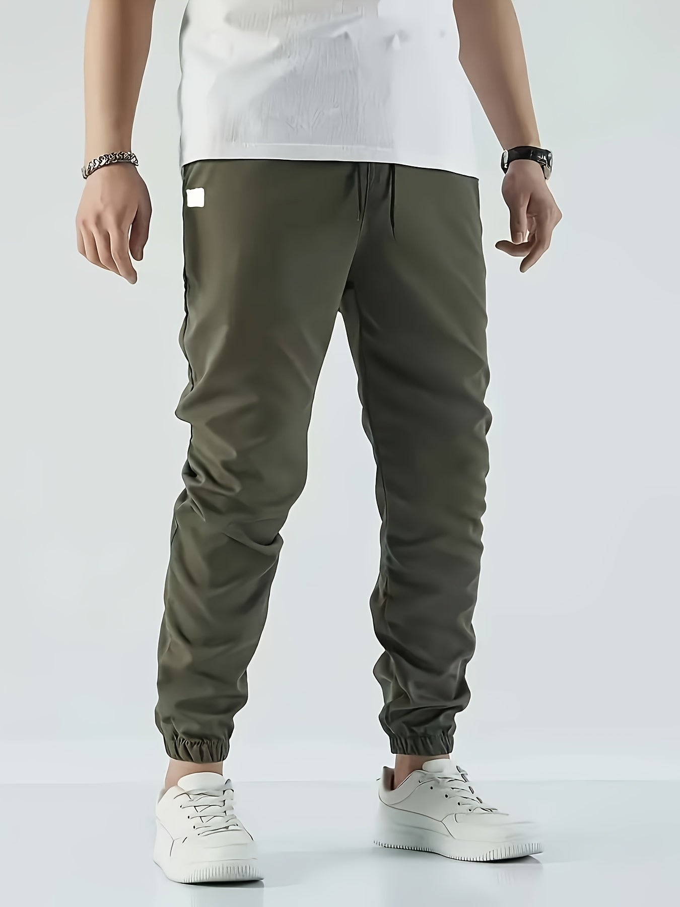 Men's Beige Cargo Pants with Multiple Pockets - Machine washable, comfortable loose fit, ideal for outdoor activities, made of durable polyester fabric.