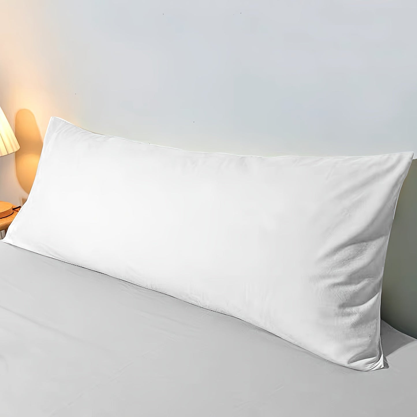 One or two pieces of white pillowcases without pillow core, made of soft and breathable fabric. These pillowcases are soft, comfortable, and suitable for use in bedrooms, guest rooms, lounges, hotels, B&Bs, and school dormitories.