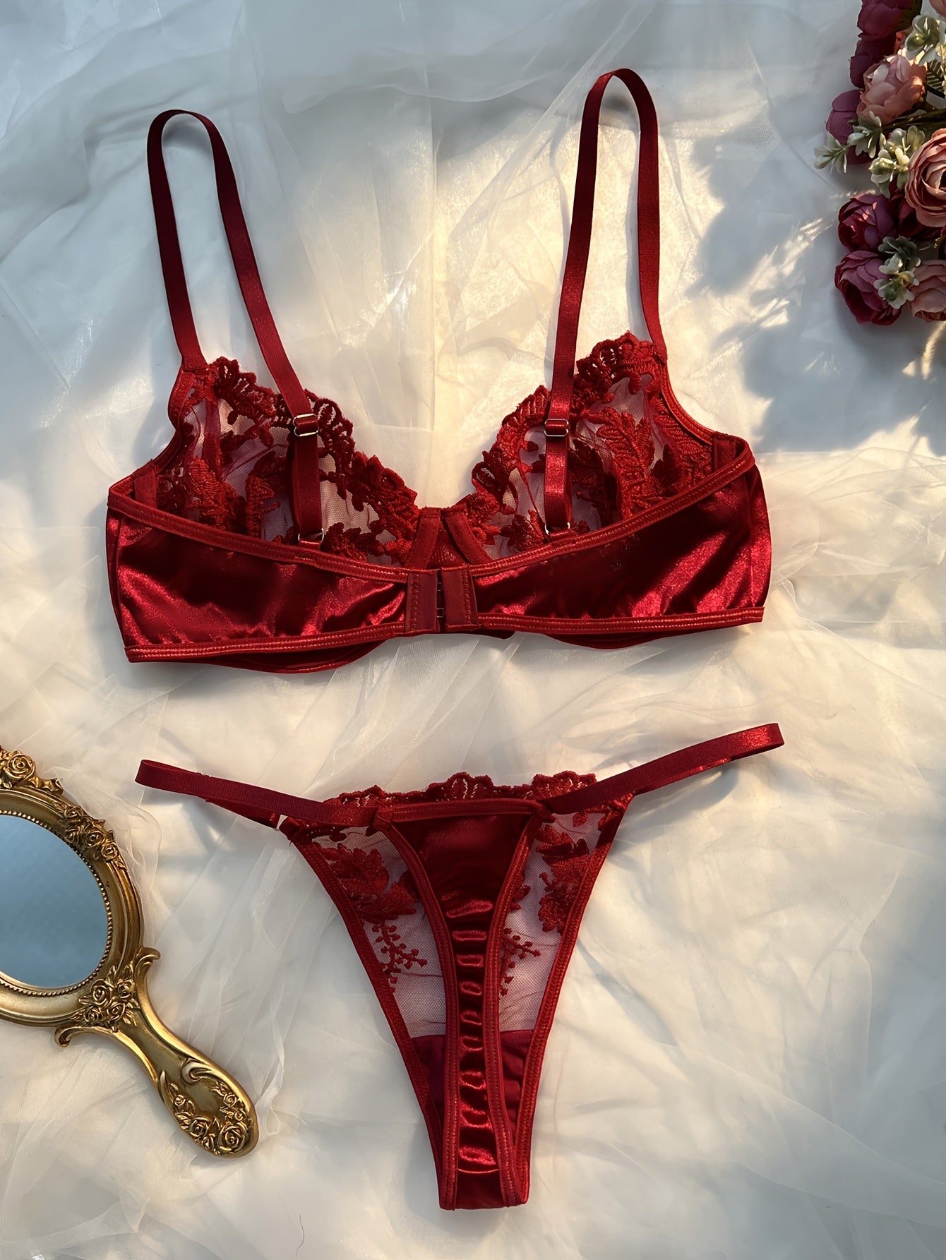 Floral embroidered lingerie set in burgundy, made from 97% polyester and 3% elastane knit fabric. Features medium support, no padding, thong panty, and drop waist - perfect as a Valentine's