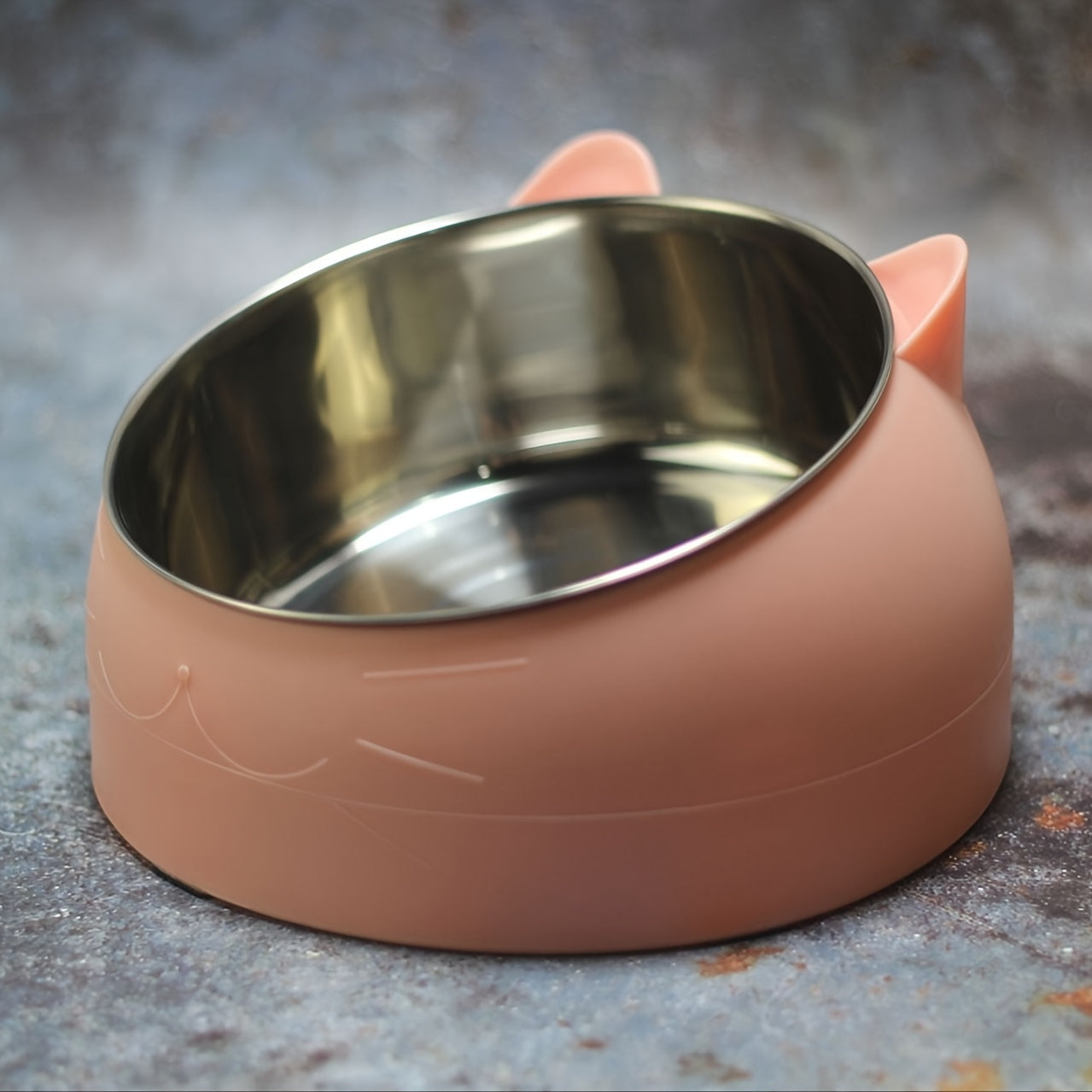 Raised stainless steel cat feeder bowl with non-slip base for neck protection, holds 100ml of food or water.