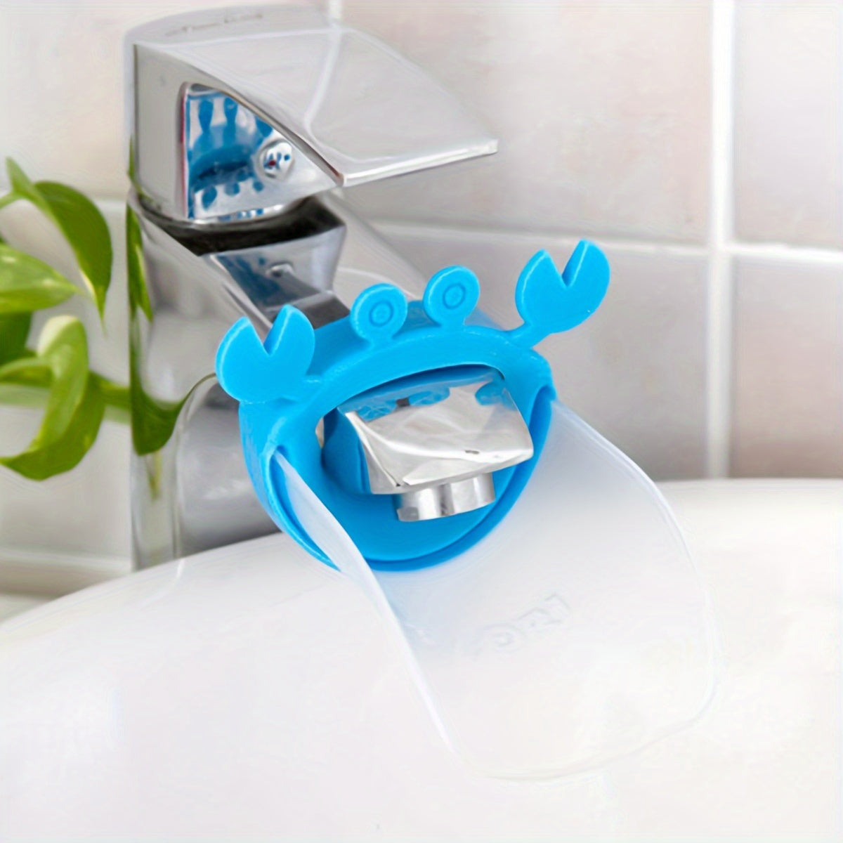 Crab-shaped water spout for kids makes hand washing fun with cartoon design.