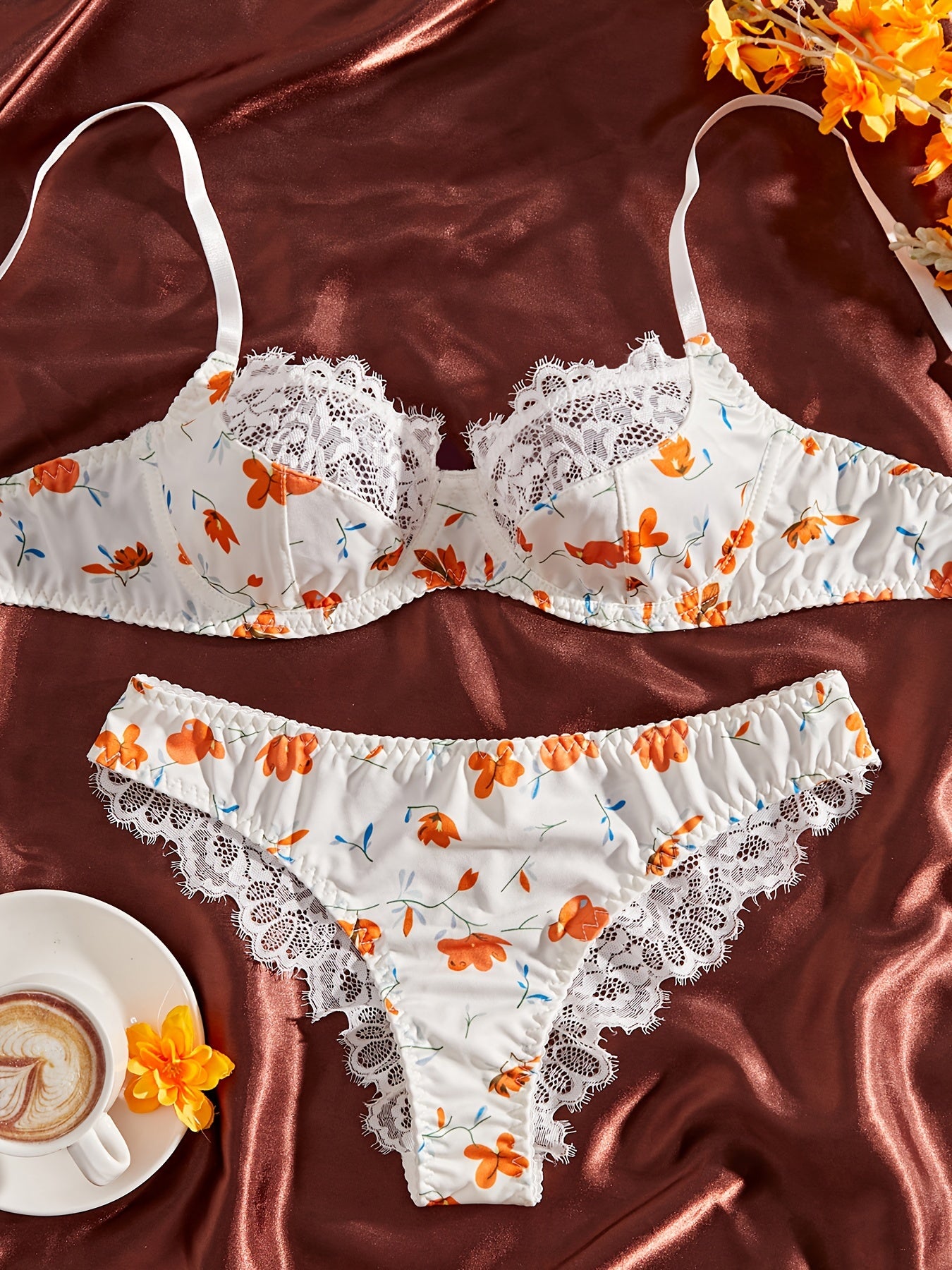 Stylish lace-trimmed floral print bra and panty set for women. Comfortable polyester blend, machine washable.