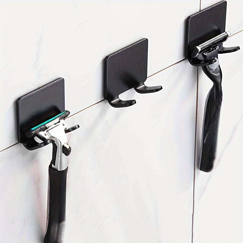 3-piece set for bathroom organization with self-adhesive razor holder and towel hooks, no drilling needed.