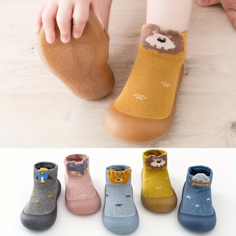 Cute lion cartoon slip-on sock shoes for baby boys in light blue with yellow accents. Soft, breathable, and non-slip rubber sole, perfect for first walkers in spring and fall.