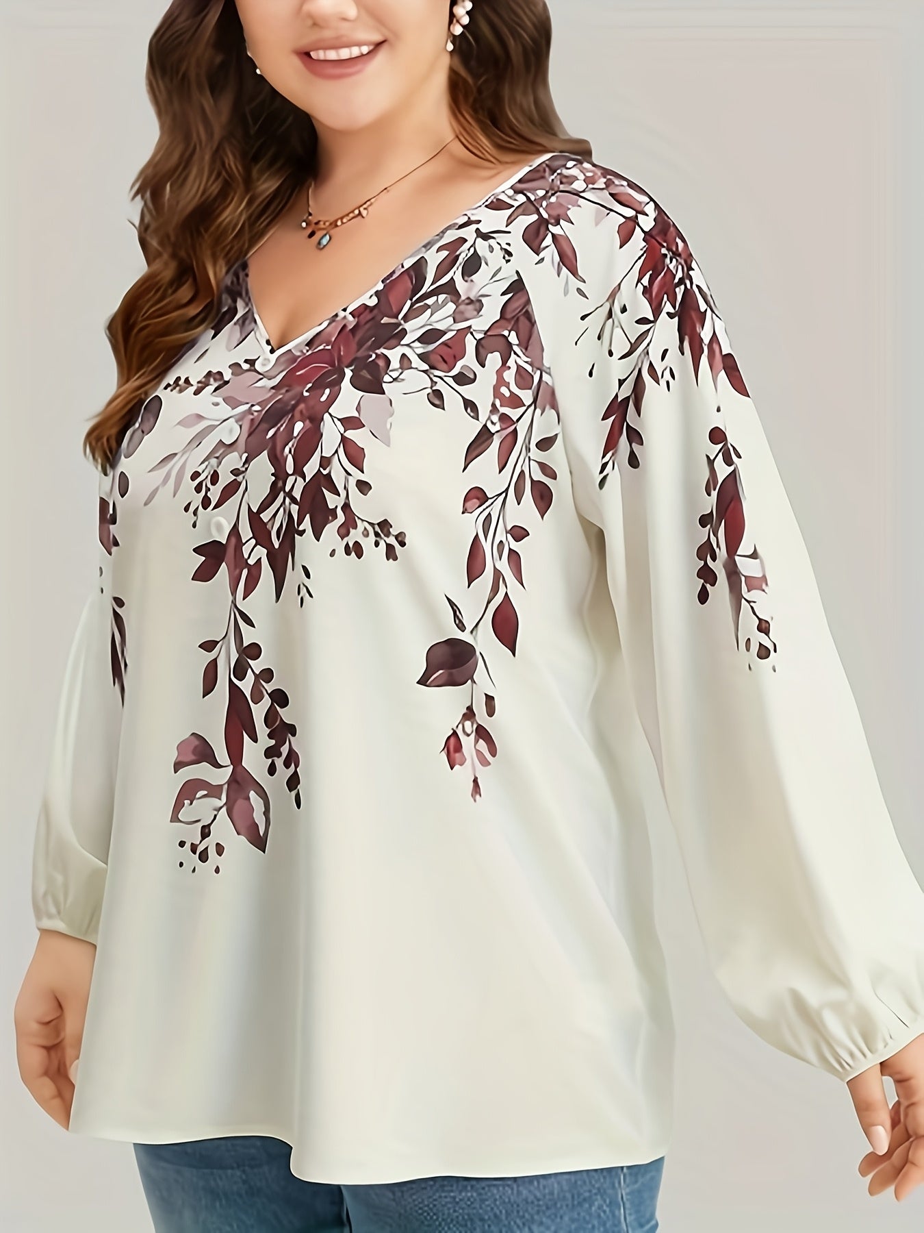 Floral print plus size blouse with V neck and long sleeves for spring. Women's plus size clothing.