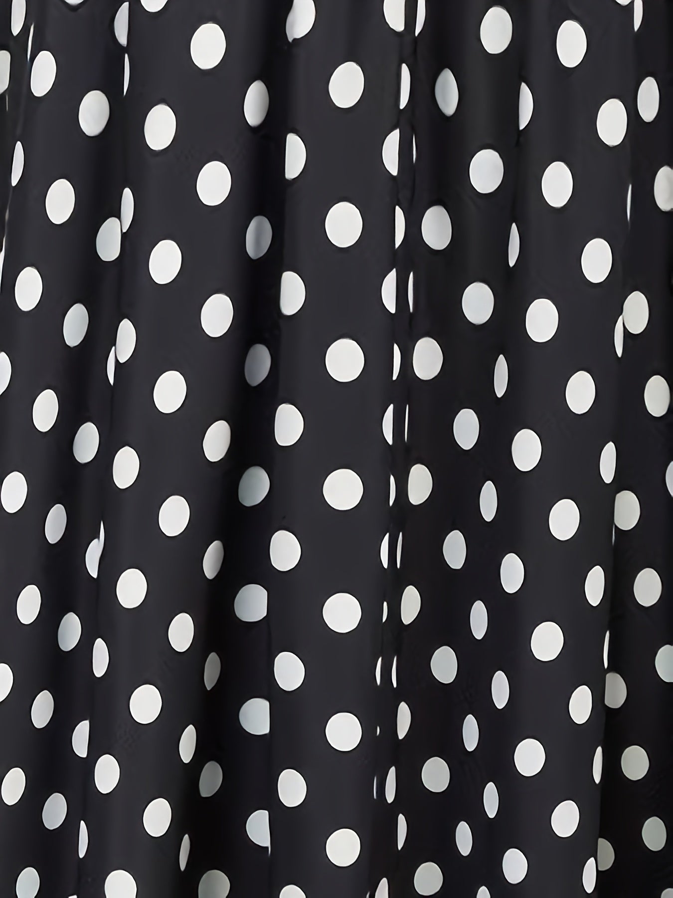 High waist flared skirt with polka dots and ruffled hem.