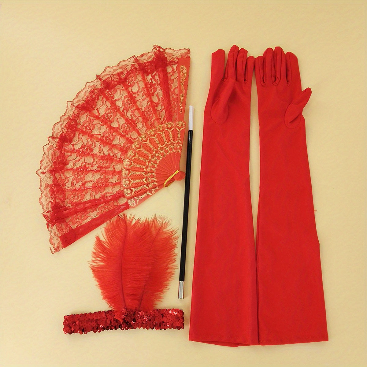 A collection of 1920s masquerade party accessories including gloves, faux feather hair clips, smoke tube fans, and other dress embellishments for women.