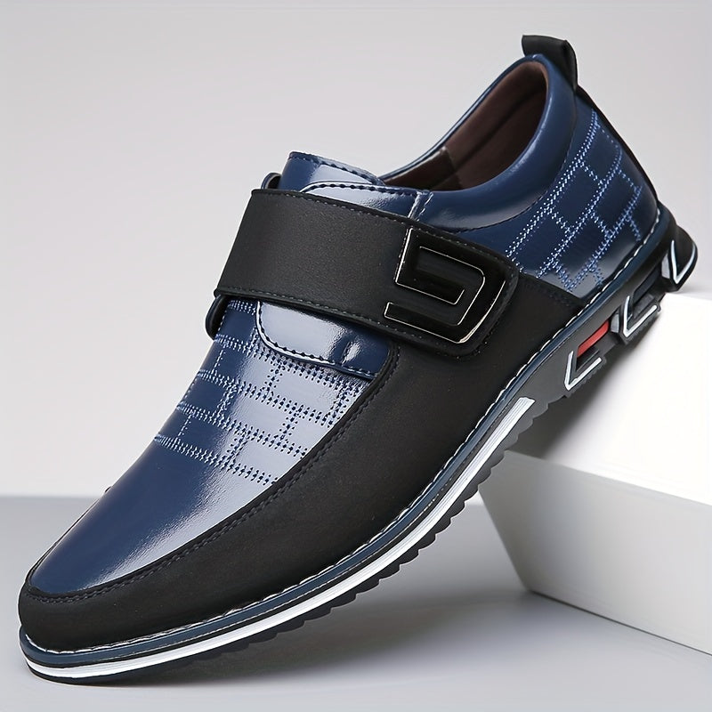 Men's dress loafers with hook and loop fastener for business or casual wear.