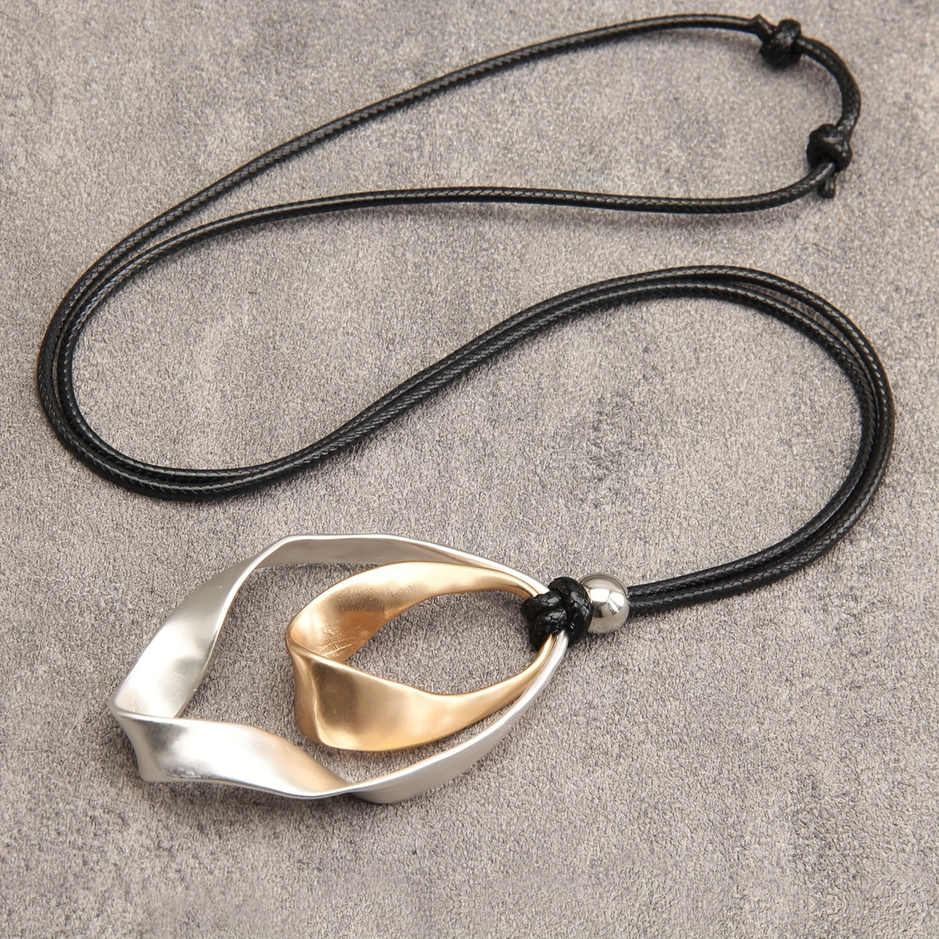 Stylish Twisted Teardrop Pendant Necklace for Women, made with Alloy featuring a Wide Edge Design. Includes a Simple Black Cord Long Chain, Perfect Romantic Gift for your Girlfriend. A Statement Jewelry Piece.