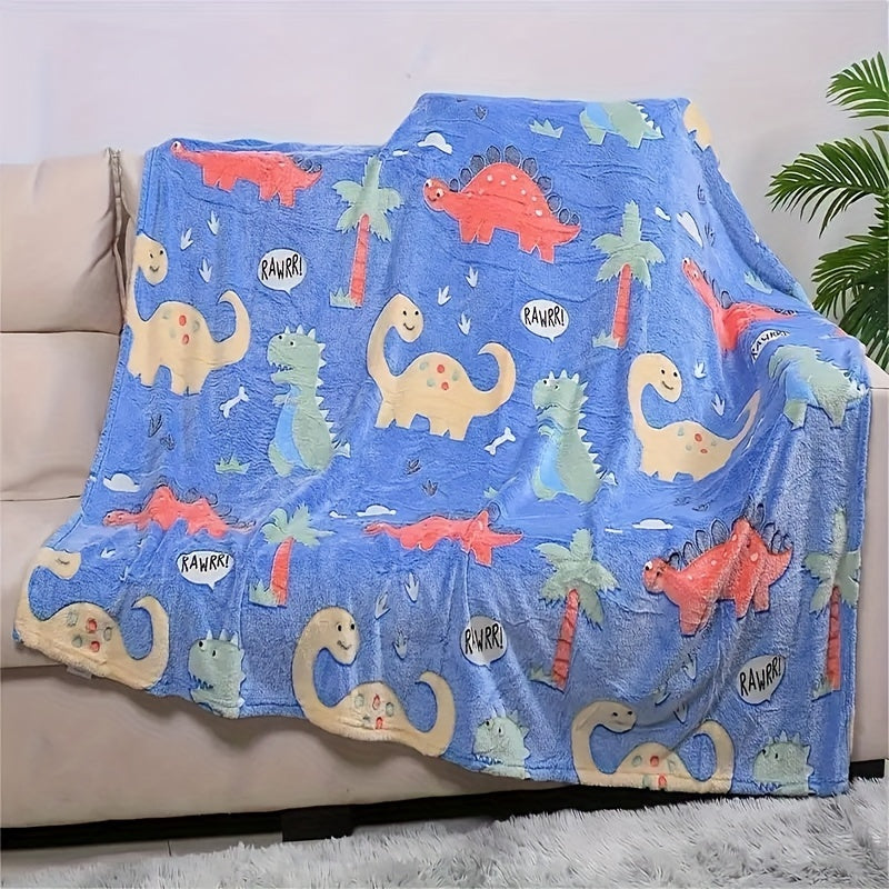 The perfect gift for dinosaur enthusiasts - a cozy blue luminous polyester throw blanket that glows in the dark.