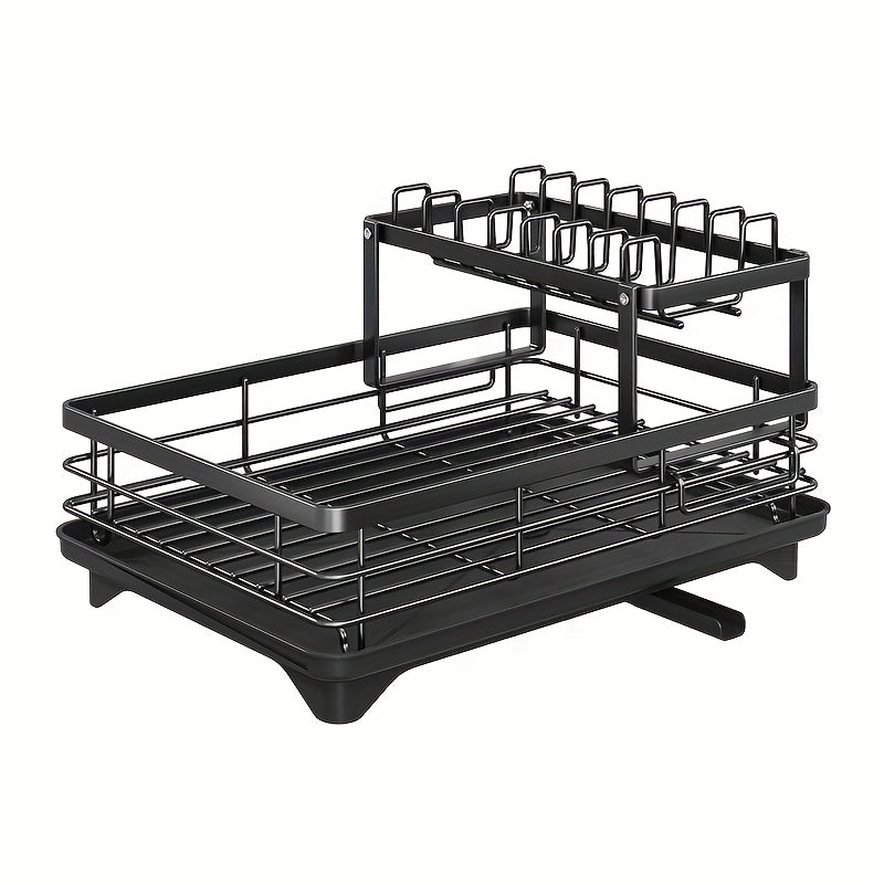 Modern two-tier metal dish rack with drainboard in black carbon steel with golden accents. Detachable upper shelf and stackable design for plates, cups, and utensils on kitchen countertop.