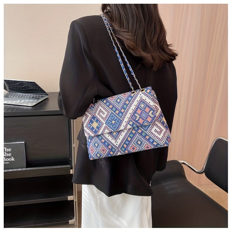 Colorful geometric shoulder bag for women with adjustable strap, magnetic closure, foldable ethnic style, and polyester lining.