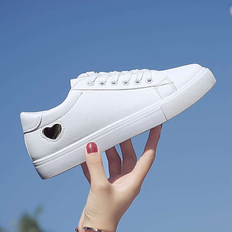 Stylish women's casual sneakers with heart-shaped design, lace-up style, and flat white soles - ideal for leisure wear.