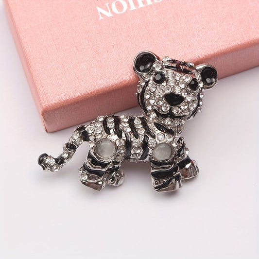 Irregularly shaped, vintage tiger brooch pin with rhinestone accent features a cute tiger design, perfect for men's suit jacket lapels.