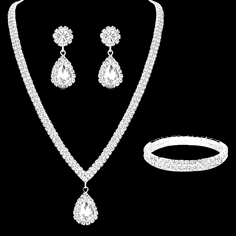 Exquisite Silver Plated Copper Jewelry Ensemble adorned with Sparkling Rhinestones - Stunning Teardrop Earrings, Necklace, and Bracelet Trio - Sophisticated Accessories for Brides & Special Occasions, Ideal Gift for Women during Christmas and Year-Round