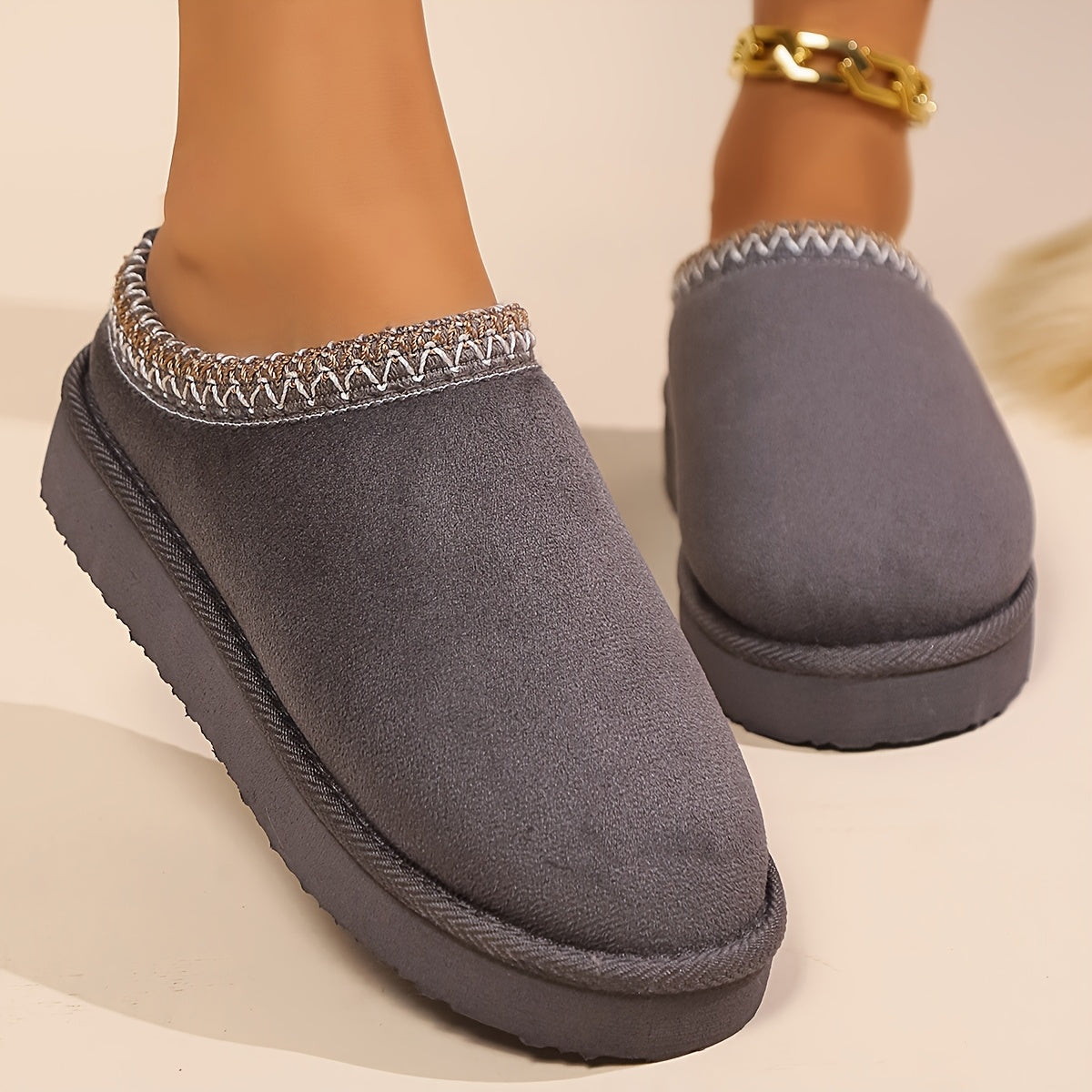 Warm and cozy women's winter slippers with plush lining and anti-slip sole.