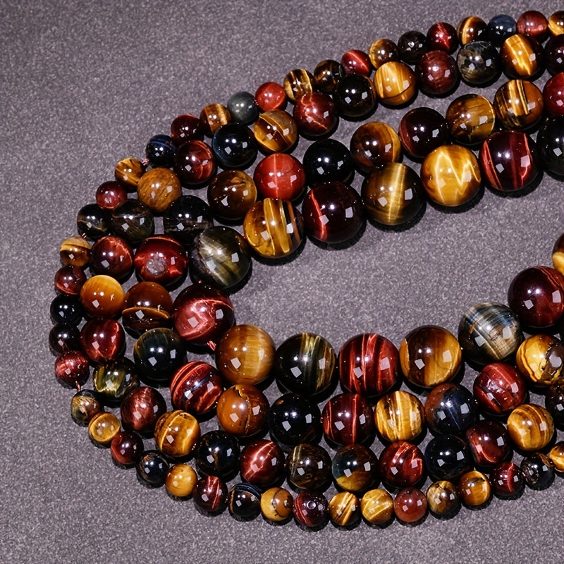 Loose round beads made from natural three-color Tiger Eye stone available for wholesale. Perfect for creating semi-finished DIY jewelry such as woven bracelets, necklaces, and sweater chains.