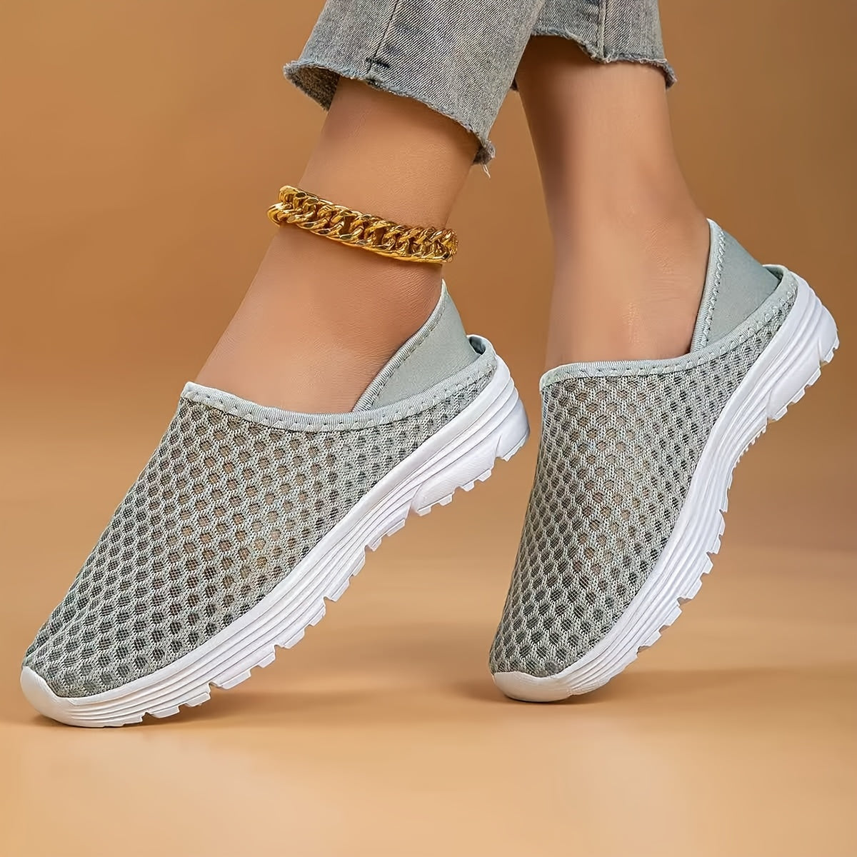 Mesh slip-on walking shoes with stability support, lightweight white summer footwear.