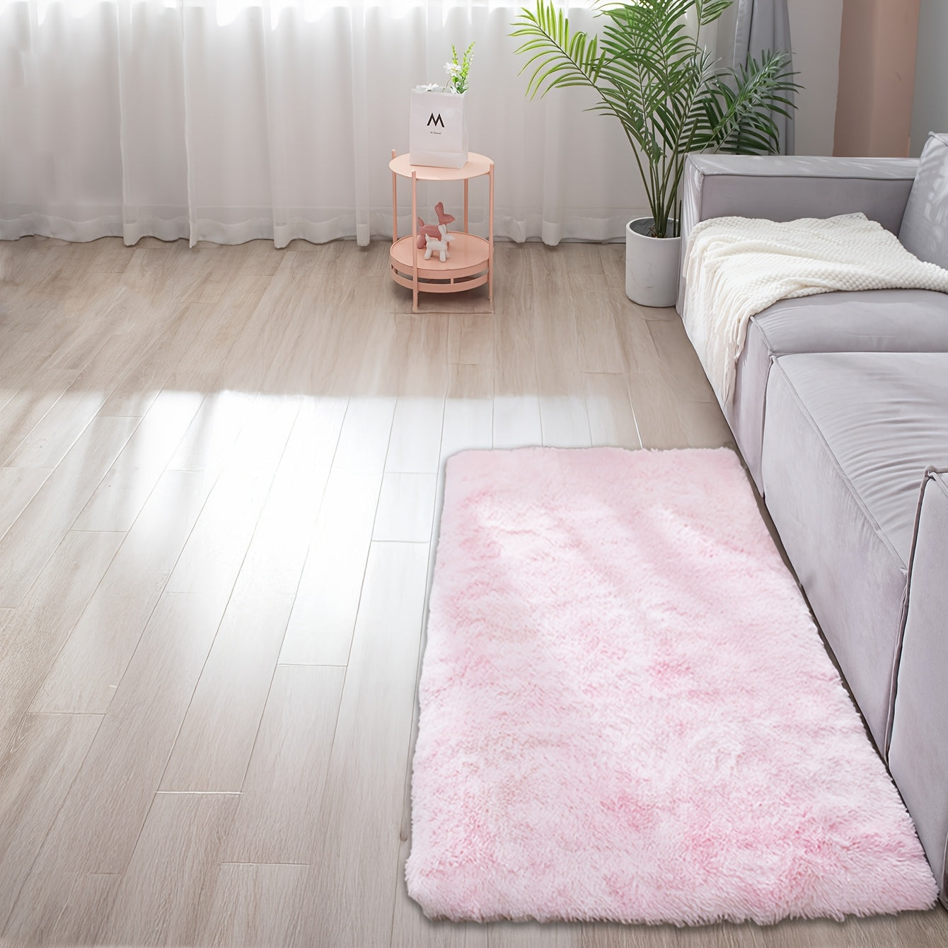 Soft and fluffy rectangle area rug perfect for your bedroom. This plush carpet is thick and non-slip, making it ideal for your living room. Made with machine-made polyester fiber, this low-pile rug is washable for easy cleaning. Perfect for indoor use.