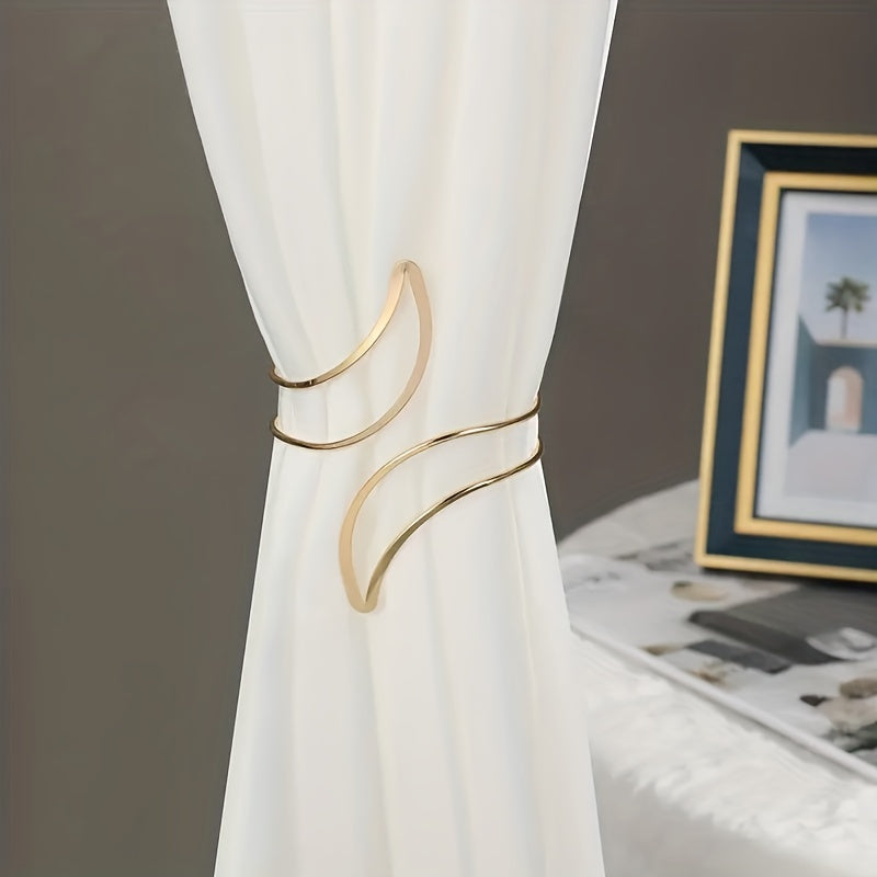 Two sets of elegant golden curtain clips, perfect for enhancing the beauty of your home decor while keeping curtains and ties in place.