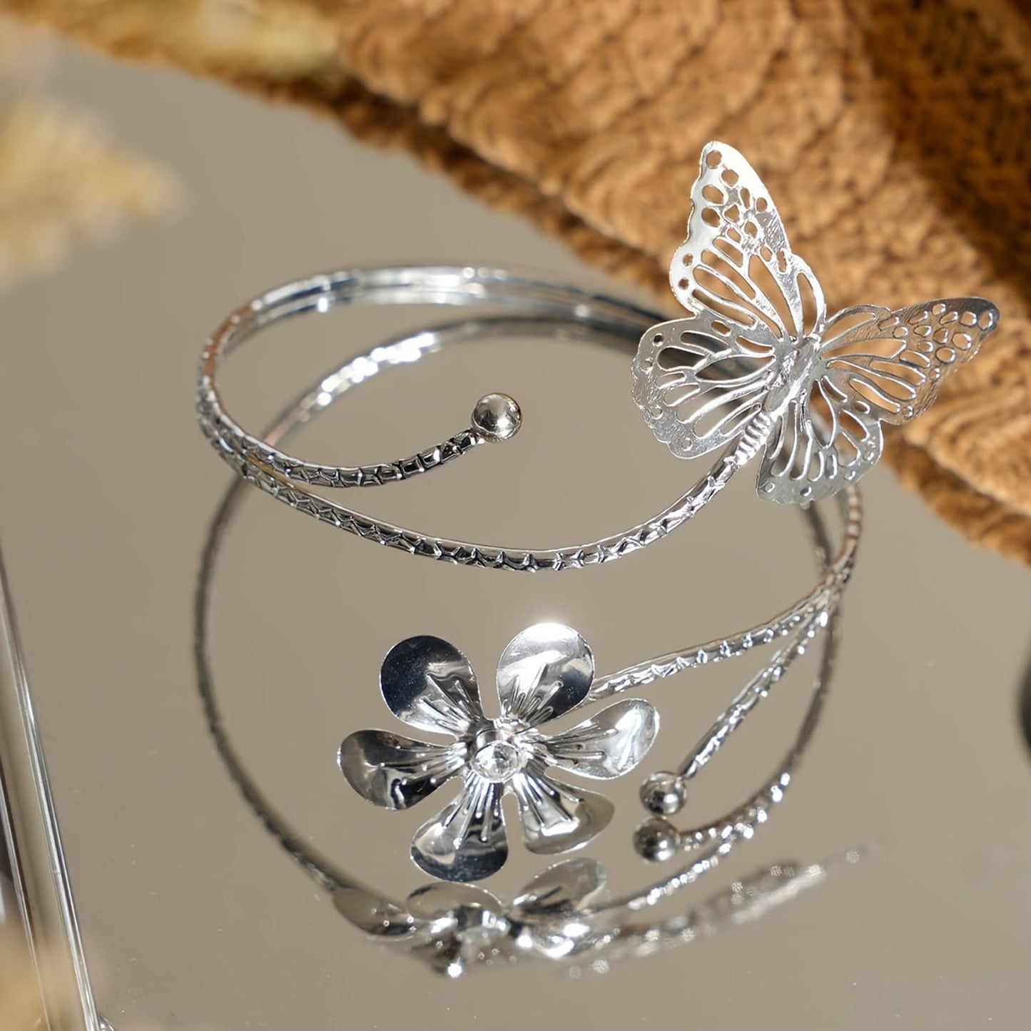 Add a touch of elegance to your home decor with these modern minimalist curtain tiebacks. Crafted in a golden/silvery butterfly and flower design, these adjustable holders can be easily installed without drilling. Perfect for the living room, bedroom, or