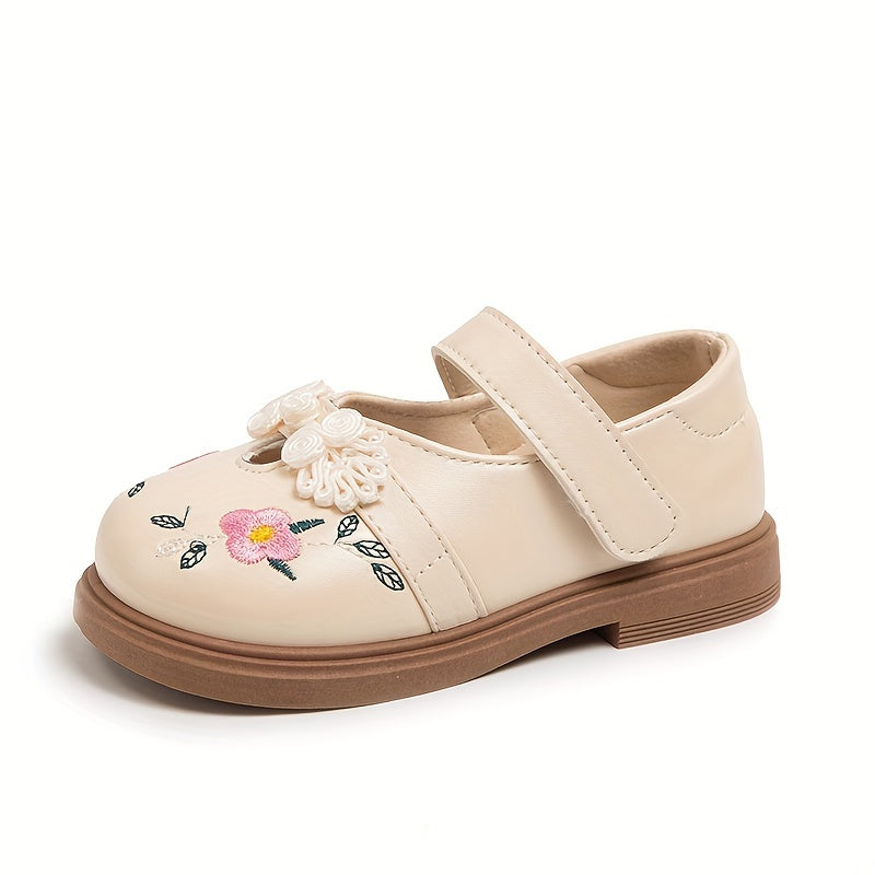 Girls' Mary Jane shoes with floral accents, soft non-slip sole for babies and toddlers.