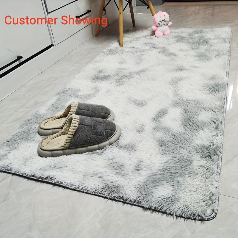 Soft and fluffy area rug for the bedroom, featuring a fuzzy shaggy design. Perfect for adding a touch of coziness to any room, with a non-slip bottom for added safety. This light grey rug is ideal for living rooms or bedrooms in need of a soft, plush