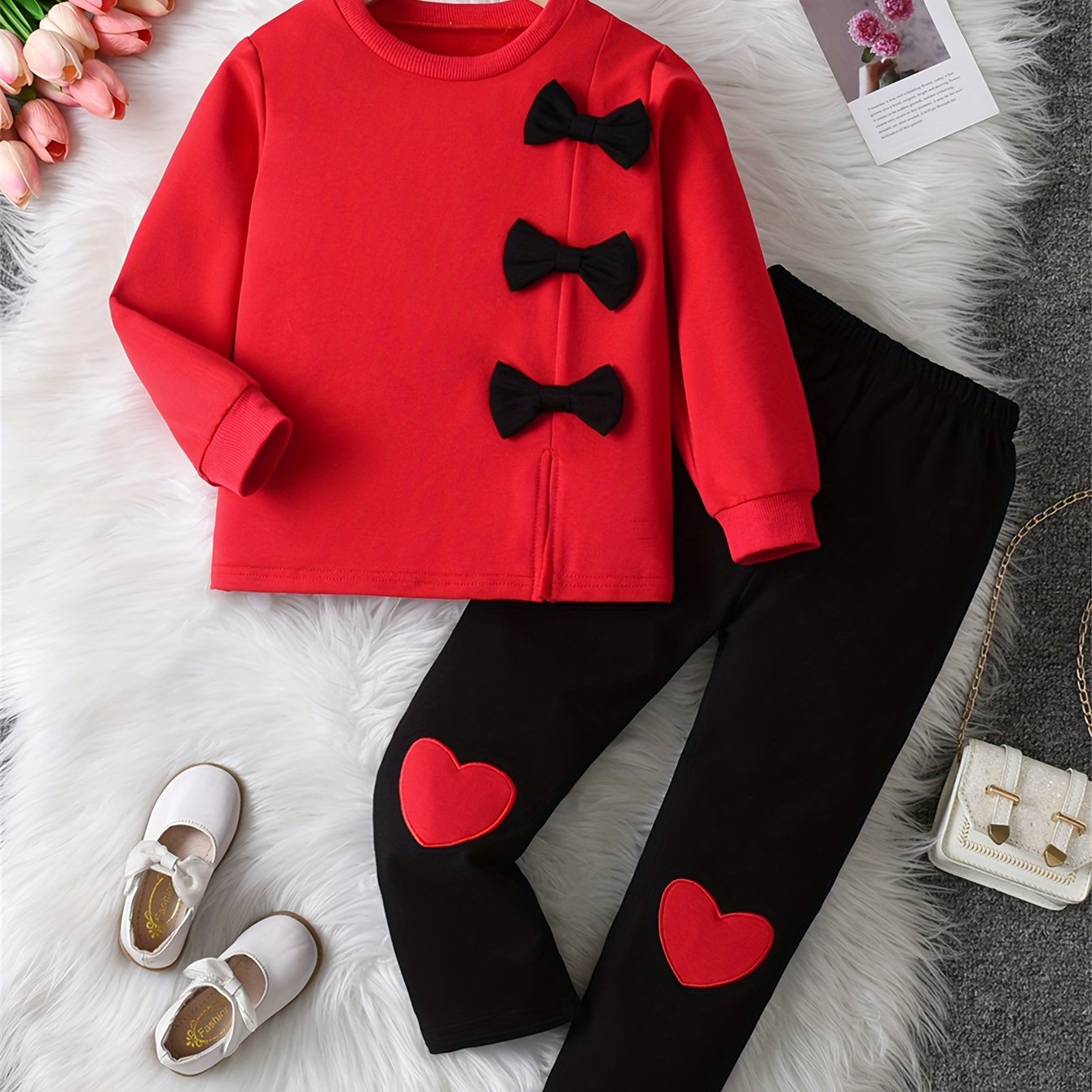 Girls' sweatshirt with bow decoration, long sleeves, and matching pants with love embroidery, ideal for outdoor activities.