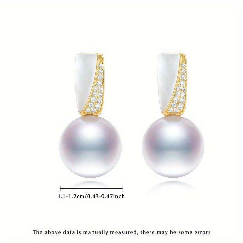 Surprise someone special with this must-have gift box containing a pair of fashionable dangling earrings for women. Made with S925 silver and featuring lustrous 11-12mm round natural freshwater pearls, each pair is unique as the natural pearls come in