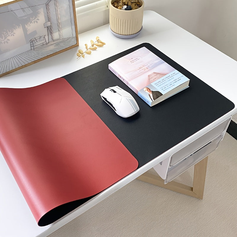 Large waterproof faux leather desk mat in black, durable and easy to clean. Ideal for writing and computer work in office or home settings.