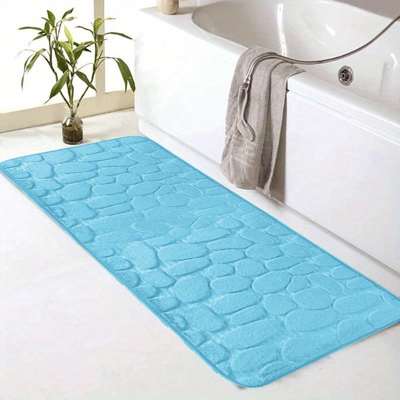 SoftTouch Cobblestone Pattern Memory Foam Bath Mat is machine washable and non-slip, making it a perfect addition to any bathroom. The absorbent polyester material resists stains, making it ideal for use in the bathtub or kitchen. This home decor runner