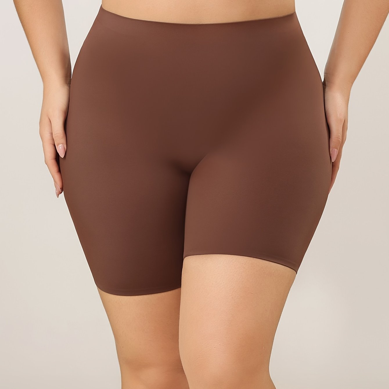 High waisted tummy control sports shorts for women that lift the butt and shape the body, made with breathable fabric.