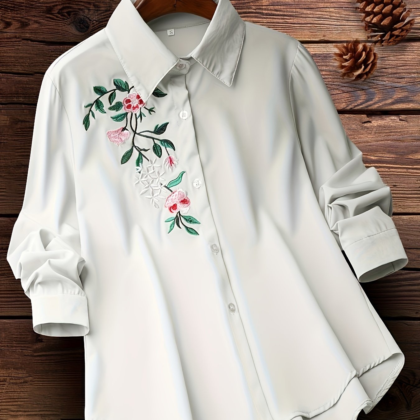 Embroidered floral button-up shirt for women, perfect for spring and fall.