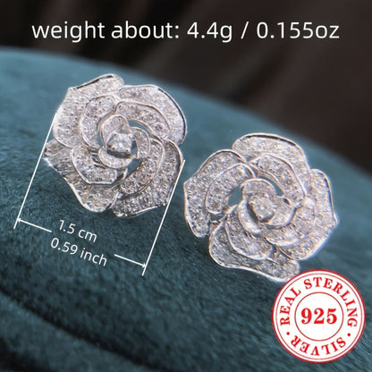 These stunning stud earrings are crafted from 4.4g of 925 sterling silver and feature synthetic zirconia stones. The elegant rose flower design exudes luxury and sophistication, making them a perfect accessory for daily wear or special occasions like