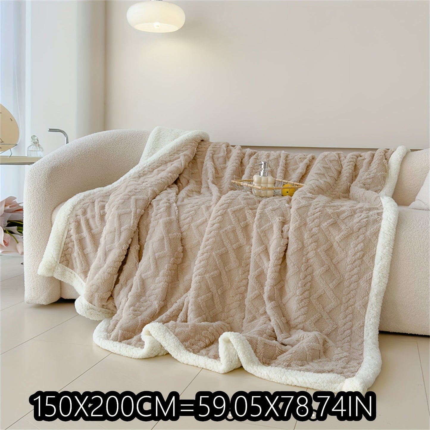 Soft cable-knit fleece blanket in blue, available in 150x200cm or 200x230cm sizes. Featuring a contemporary style, this blanket is machine washable and perfect for use in the bedroom, living room, office, or while camping during the winter. Made with a