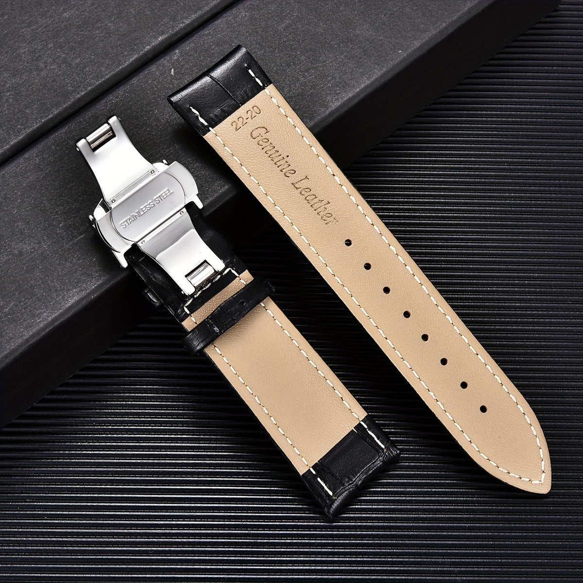 Watchband made of PU leather with stainless steel butterfly deployment buckle clasp, available in sizes 18mm, 20mm, 22mm, and 24mm, comes with a box.